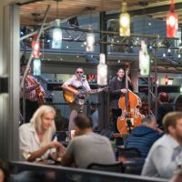 musicians playing in an outdoor cafe. - concert stock pictures, royalty-free photos & images