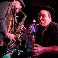 musicians playing saxophone at nightclub - concert stock pictures, royalty-free photos & images