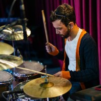 musicians plays drums on stage - concert stock pictures, royalty-free photos & images