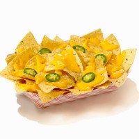 nachos with cheese sauce and sliced jalapenos in a take out container - junk food stock pictures, royalty-free photos & images