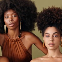 natural beauty, model and black women with an afro hairstyle with a fashion pose. portrait of female empowerment of people with diversity and beautiful skin looking stunning with a green background - fashion stock pictures, r