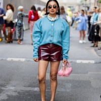 Navdeep Kaur wears blue oversized jacket, burgundy shorts, pink Chanel bag, sunglasses, pearl necklace outside Rotate during day four of the...