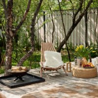 neat and tidy terrace with easy chairs firewood placed on daylight - garden decoration stock pictures, royalty-free photos & images