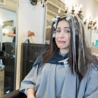 nervous young woman at hair salon - hairstyle stock pictures, royalty-free photos & images