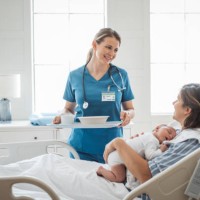 new born baby with his mother at hospital - food stockfoto's en -beelden