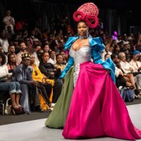Nigerian influencer Anita Natacha Akide, popularly known as Symply Tacha, wears a creation by Nigerian hair brand Lush Hair as she walks the runway...