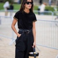 Nina Urgell Cloquell wears black shirt, high waisted pants, basket bag, sunglasses outside Loewe during Womenswear Spring/Summer 2025 as part of...