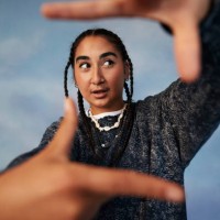 non-binary person gesturing finger frame while standing against colored background - fashion stock pictures, royalty-free photos & images