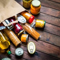 non-perishable foods coming out a paper bag. copy space - food stock pictures, royalty-free photos & images