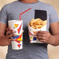 obese boy with snack - junk food stock pictures, royalty-free photos & images