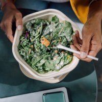 office worker having take out healthy salad bowl for lunch break enjoying a beautiful weather - junk food stock pictures, royalty-free photos & images
