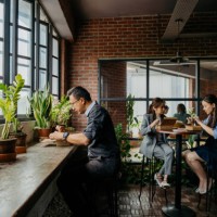 office workers having lunch break in office lounge - junk food stock pictures, royalty-free photos & images