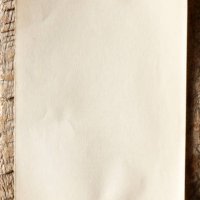 old paper nailed to a weathered wooden board. - nails art stock pictures, royalty-free photos & images