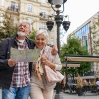 older travelers are sightseeing the city during a vacation using a city map. - travel stock pictures, royalty-free photos & images