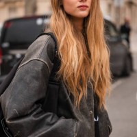 Olivia Vinten wears brown leather jacket, outside Chanel, during the Womenswear Fall/Winter 2024/2025 as part of Paris Fashion Week on March 05, 2024...