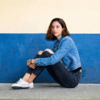 one hispanic teenage girl sitting on the floor in mexico city, mexico - fashion stock pictures, royalty-free photos & images