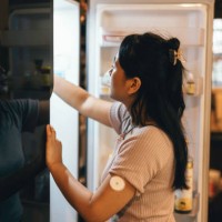 one woman, beautiful female using taking soda from refrigerator in kitchen. at home - junk food stock pictures, royalty-free photos & images