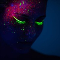 one woman painted with fluorescent make up - fashion stock pictures, royalty-free photos & images