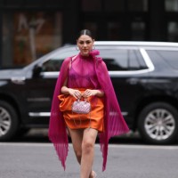 Oralia A. Villarreal Cantú was seen wearing a light pink Miu Miu bag, a black bra, a orange silk skirt, silver high heels and a transparent pink top...