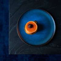 orange cake on blue plate - food stock pictures, royalty-free photos & images