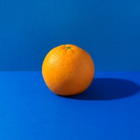 orange on blue background - food stock pictures, royalty-free photos & images