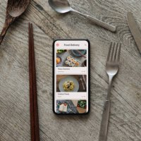 ordering food by mobile app delivery on smartphone - junk food stock pictures, royalty-free photos & images