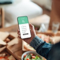 ordering food delivery on smart phone - food stock pictures, royalty-free photos & images