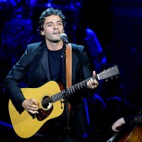Oscar Isaac performs during the 25th Anniversary Rainforest Fund Benefit Concert at Carnegie Hall on April 17, 2014 in New York City.