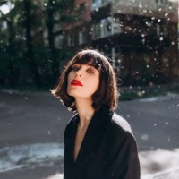 outdoor portrait of young brunette in black jacket - fashion stock pictures, royalty-free photos & images