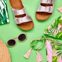 overhead shot of summer vacation accessories on green background - fashion stock pictures, royalty-free photos & images