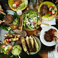 overhead view of friends dining at table outdoors - food stock pictures, royalty-free photos & images