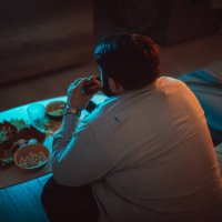 overweight man eating a burger - junk food stock pictures, royalty-free photos & images