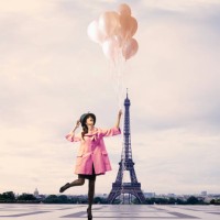 pacific islander woman with balloons near eiffel tower, paris, ile - fashion stock pictures, royalty-free photos & images