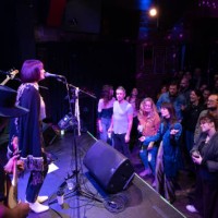 packed crowd at small venue watching band perform on stage - concert stock pictures, royalty-free photos & images