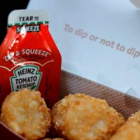 Packet of Heinz ketchup is displayed with Chick-fil-A hash browns on April 12, 2021 in Novato, California. Packets of ketchup are in short supply as...