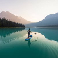 paddleboarding emerald lake at sunrise in yoho national park - travel stock pictures, royalty-free photos & images