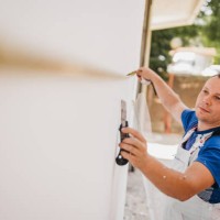 painter measures the wall with a tape measure - home decoration stock pictures, royalty-free photos & images