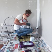painting the playroom with baby. - home decoration stock pictures, royalty-free photos & images