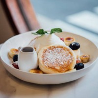 pancake with whipped cream and fruits freshly served on a marble table - food stock pictures, royalty-free photos & images