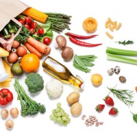 paper bag full of different food on white background - food stock pictures, royalty-free photos & images
