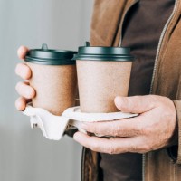 paper cup with coffee in man's hands. - junk food stock pictures, royalty-free photos & images