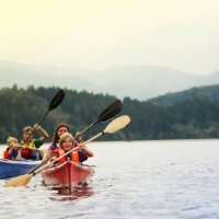parents and sons (10-12) canoeing on lake, staffel lake, murnau, bavaria, germany - travel stock pictures, royalty-free photos & images