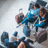 passengers sitting on seats in departure area - travel stock pictures, royalty-free photos & images