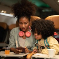 passengers women and children traveling on planes. - travel stock pictures, royalty-free photos & images