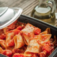 pasta in tomato sauce in plastic container - junk food stock pictures, royalty-free photos & images