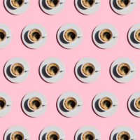 pattern made of cup of fresh coffee on pastel pink color background. - coffee stockfoto's en -beelden