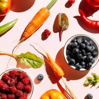 pattern of variety fresh of organic berry fruits and vegetables and healthy vegan meal ingredients on pink background. healthy food, clean eating, diet and detox, eco friendly, no plastic concept. flat lay, top view - food st