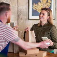 paying for her food order - junk food stock pictures, royalty-free photos & images