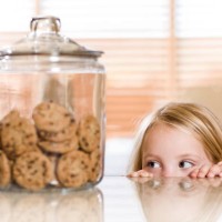 peeking over the counter - junk food stock pictures, royalty-free photos & images