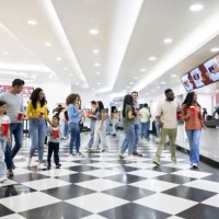 people at the cinema buying snacks at the concession stand - junk food stock pictures, royalty-free photos & images